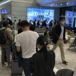 Pasajeros preparándose para embarcar en el aeropuerto de Jianxim, al norte de China.