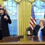 President Donald Trump listens as Elon Musk, joined by his son X Æ A-Xii, speaks in the Oval Office at the White House, Tuesday, Feb. 11, 2025, in Washington. 
