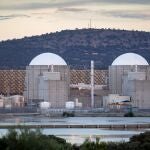 Almaraz, nuclear power plant in the center of Spain, surrounded by a green field.